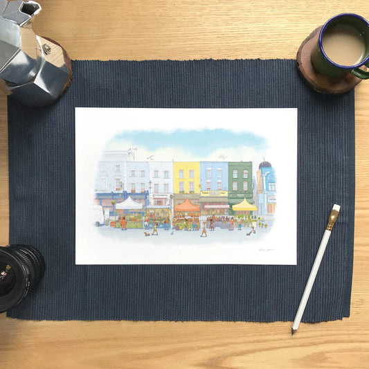 Wall art print of an illustration of Portobello Road market in London's Notting Hill with a pencil and cup of coffee