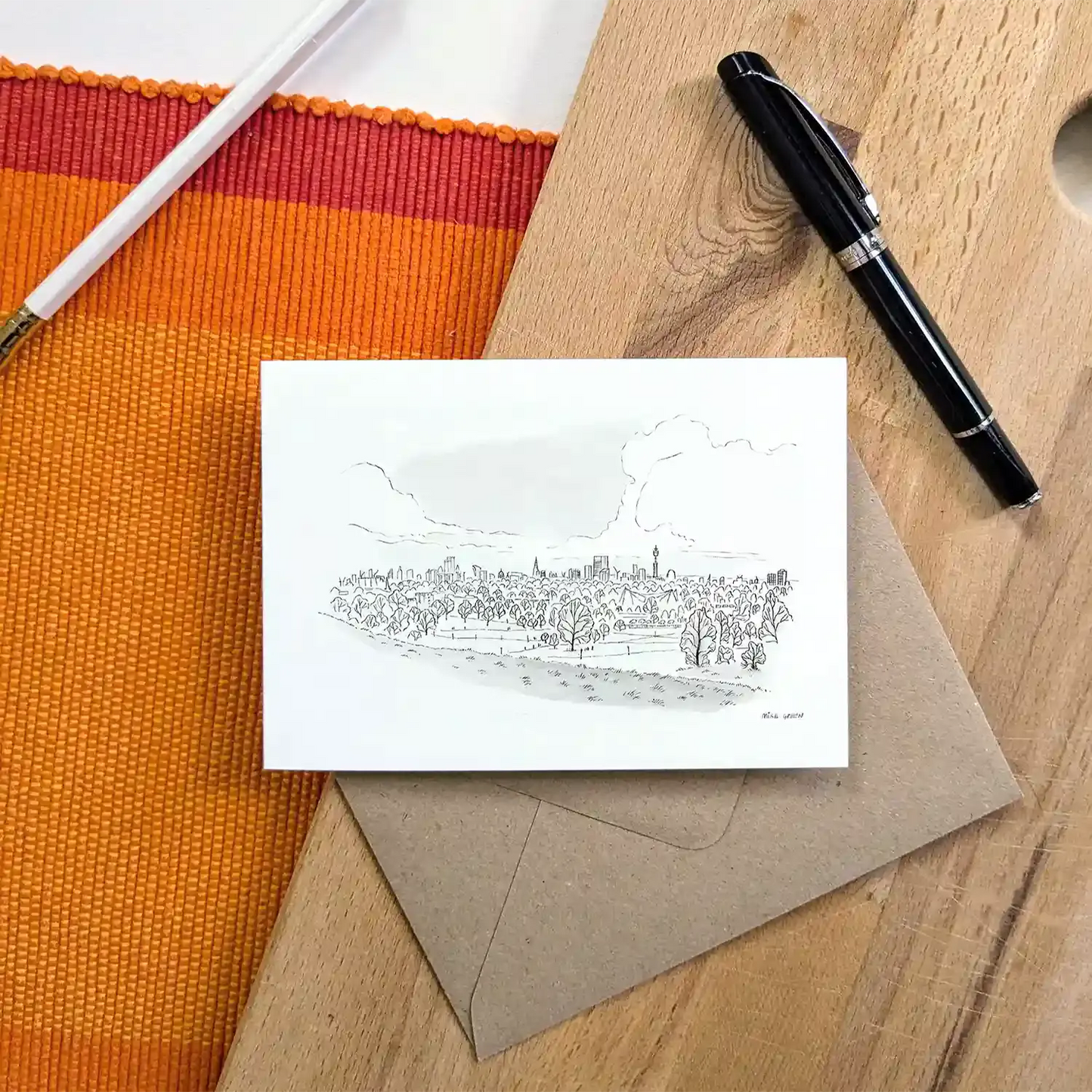 The view from Primrose Hill sketched on a greeting card with an envelope and pen