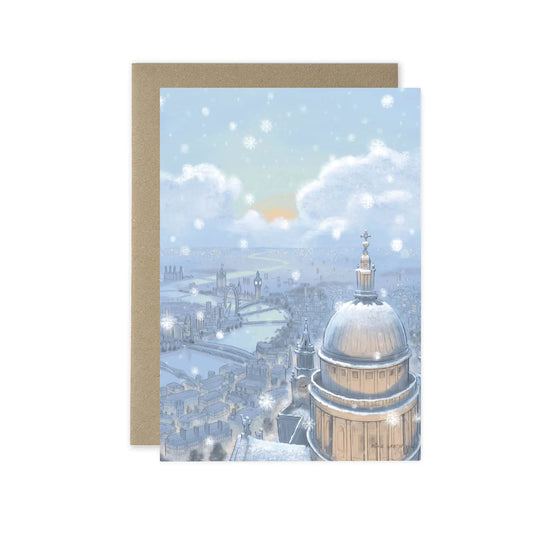 Christmas greetings card with London's St Pauls Cathedral in the snow at nighttime with a nested envelope