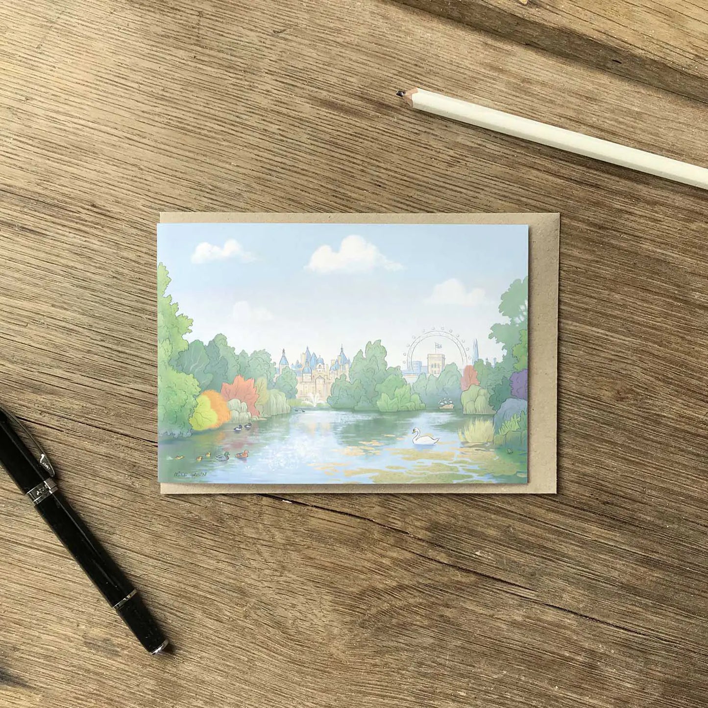 Greeting card with illustration of St James's Park in London including the park wildlife with an envelope and pen