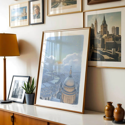 Framed wall art print of a painting London's skyline at night with St Paul's Cathedral on chest of drawers with pictures on a wall
