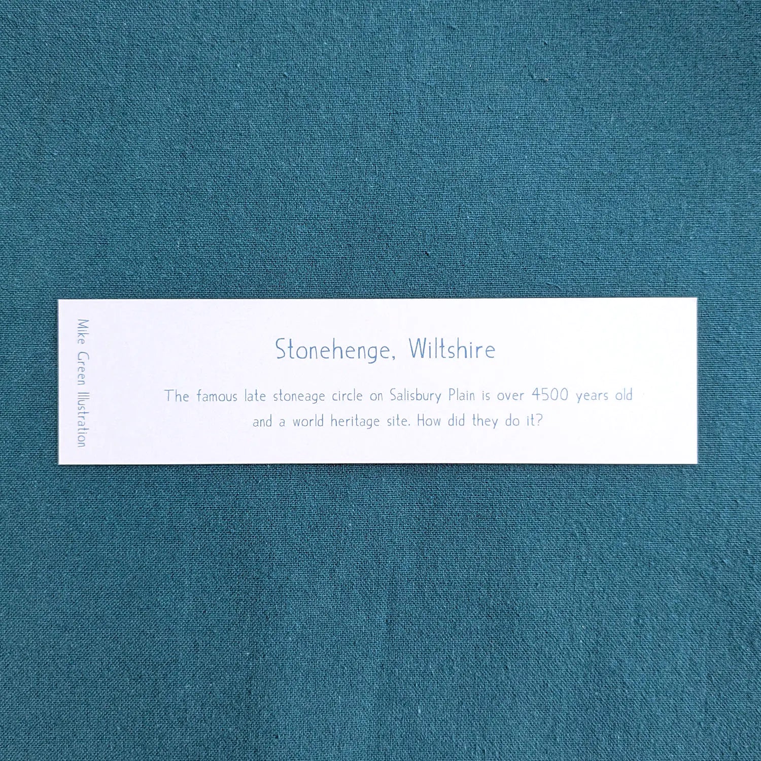 Text on the back of a bookmark with a painting of Stonehenge in Wiltshire England