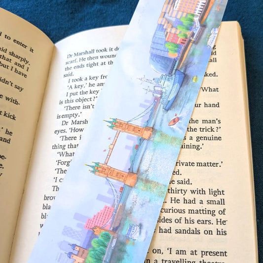 Tower bridge on the river Thames in London illustrated on a bookmark resting on an open book