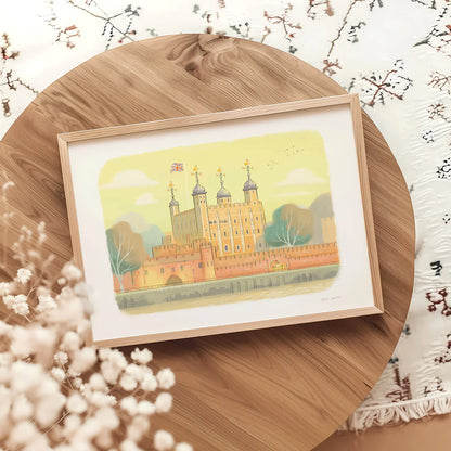 A framed art print of the Tower of London landmark on a round table