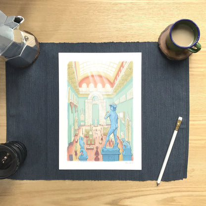 Wall art print of a painting of the Weston Cast Court in the Victoria and Albert Museum in London's South Kensington on a matt with a pencil and cup of coffee