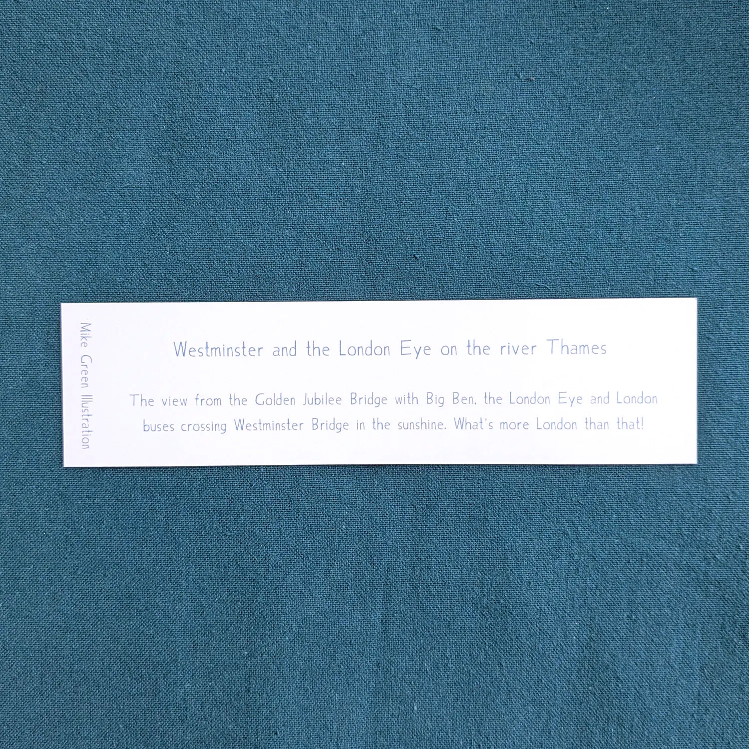 Back of a bookmark of Westminster's Big Ben and the London Eye on the Thames in London