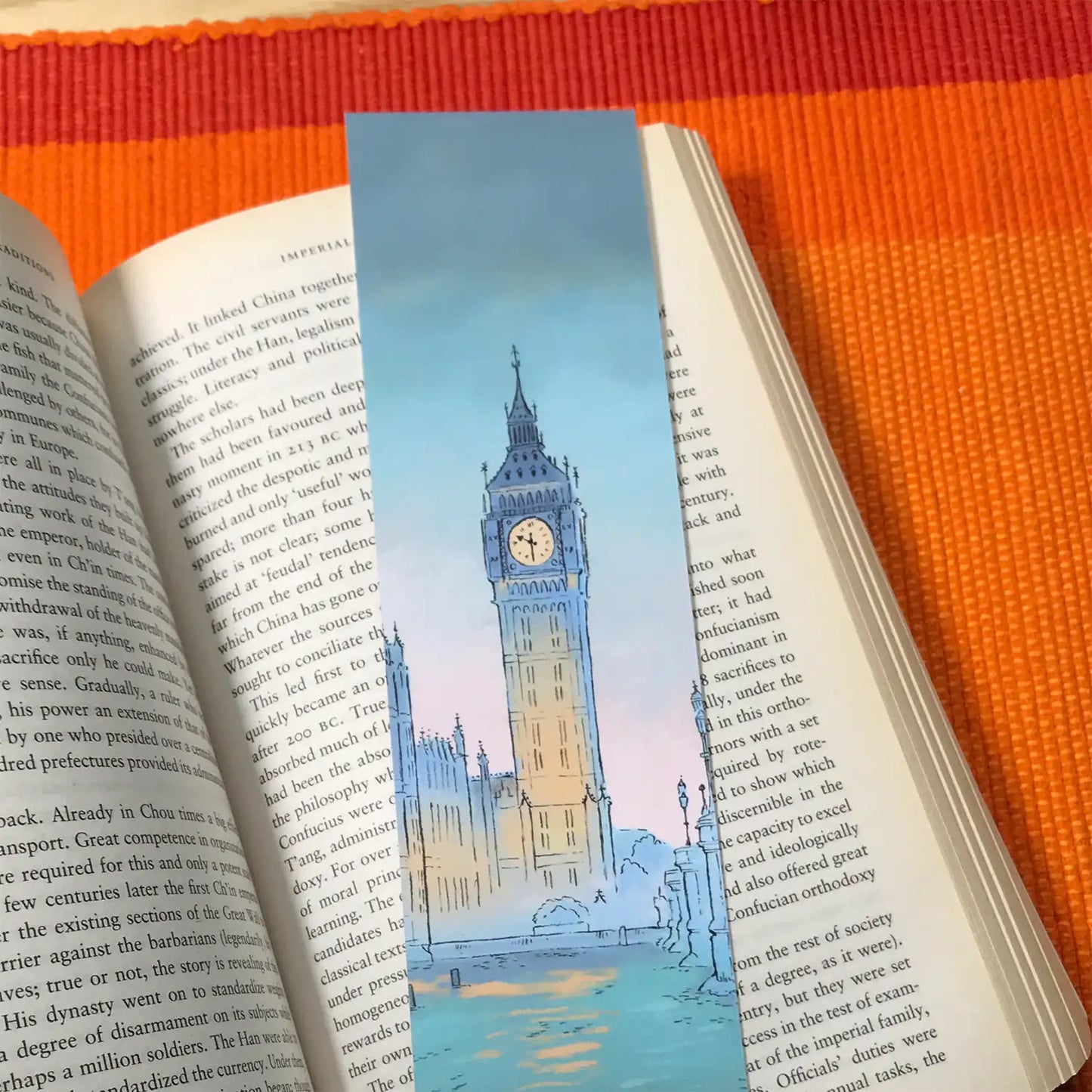 Westminster at Twilight bookmark by Mike Green Illustration resting on a book