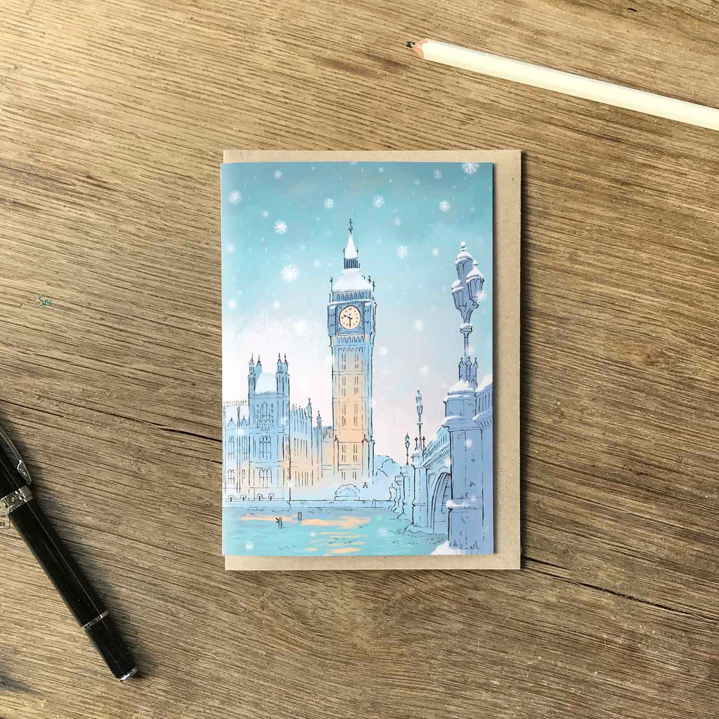 Westminsters Big Ben in the snow beautifully illustrated on a greeting card by mike green illustration.